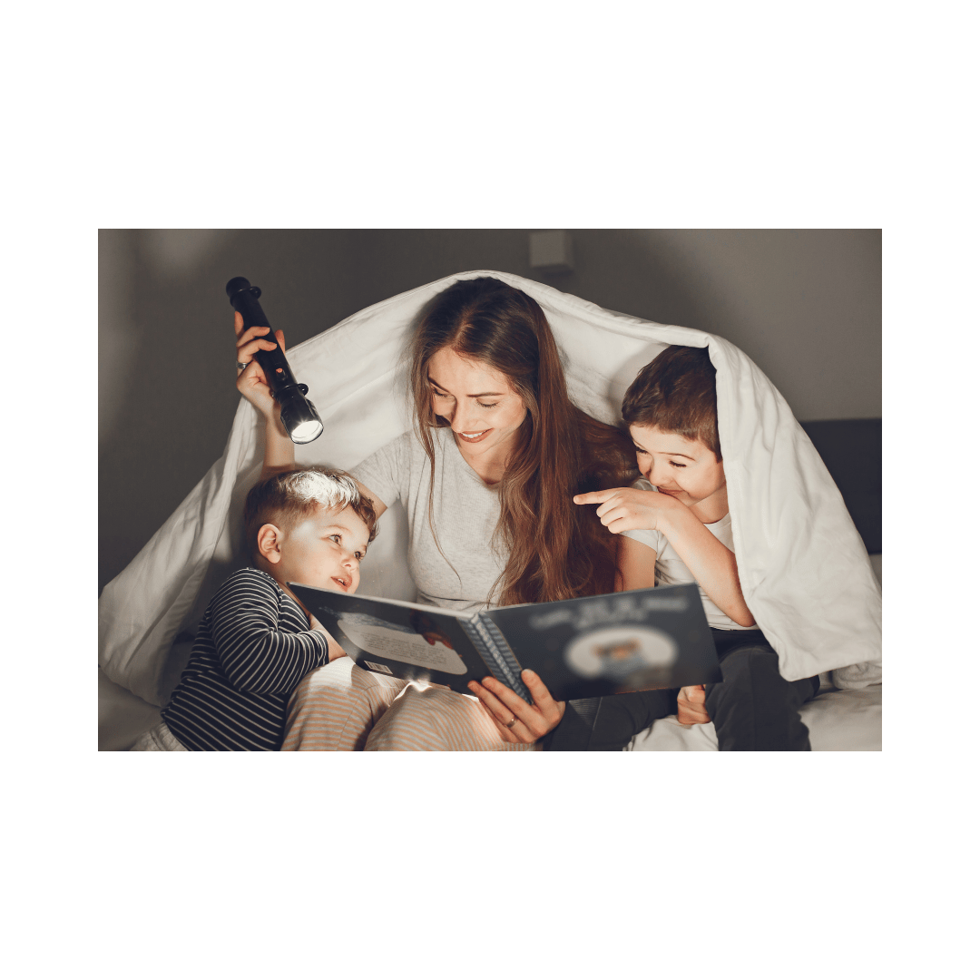 Homeschooling mompreneur playing in a sheet tent with her boys Homeschooling mompreneur playing in a sheet tent with her boys