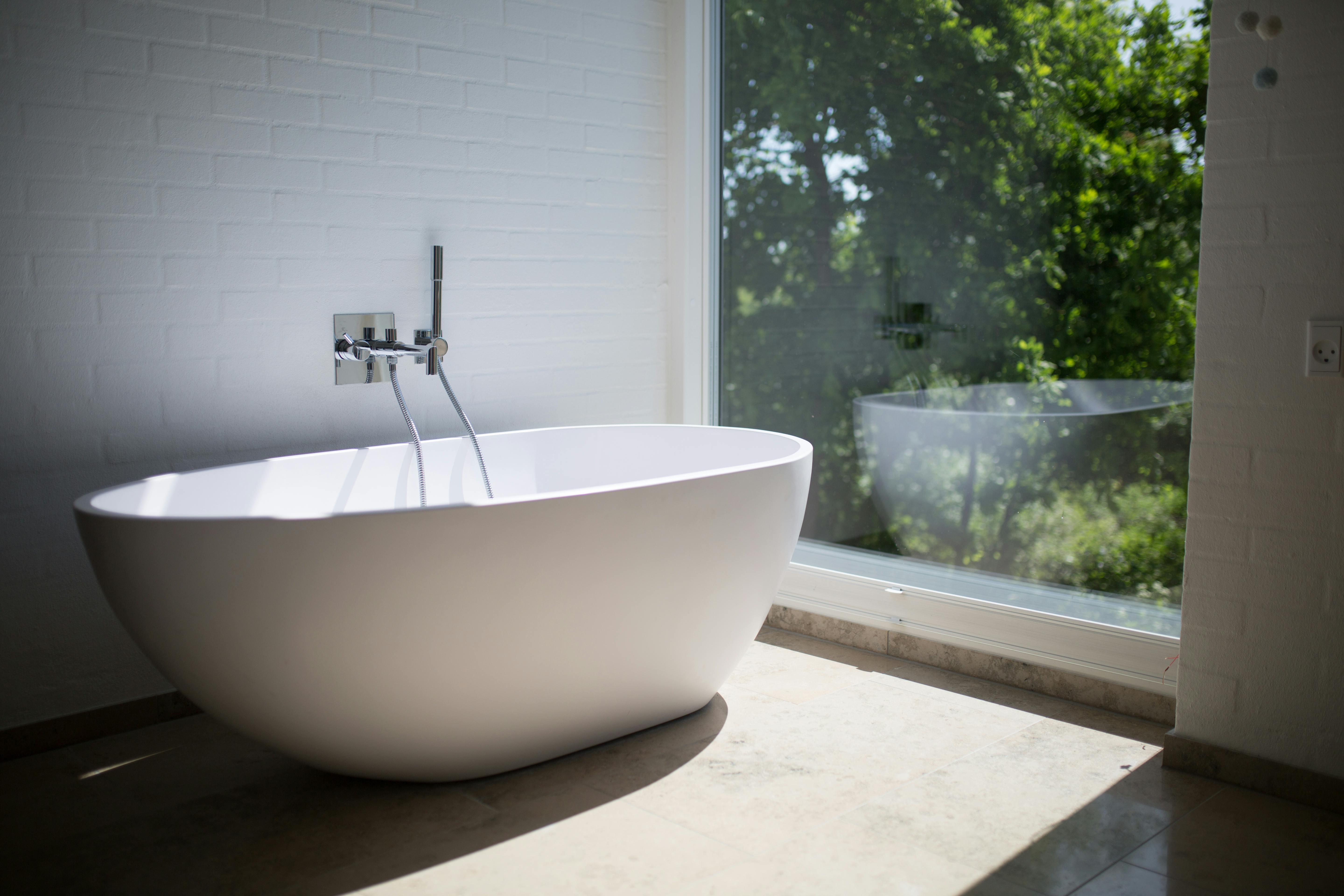 Modern bathroom with frameless glass shower and floating vanity showcasing contemporary design elements