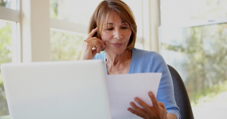 Senior hispanic woman checking her Medicare inscription