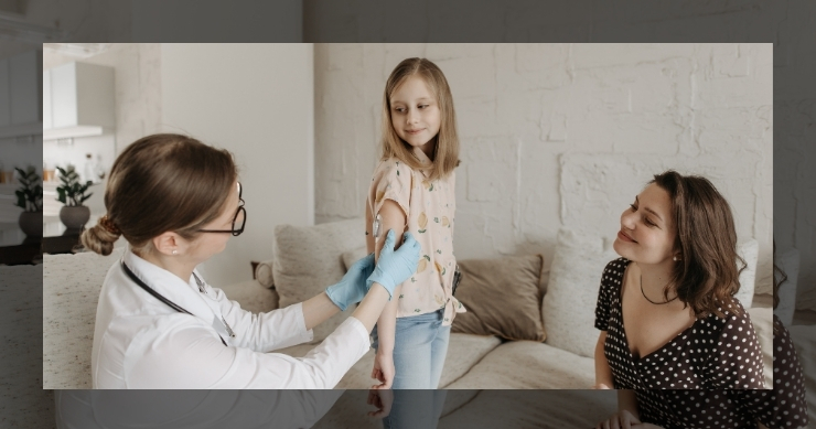 Primary care doctor vaccinating a girl.
