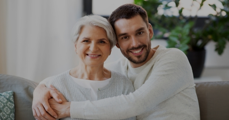mother and son hugging and smiling at home