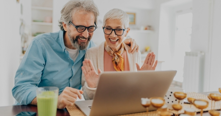 senior couple reviewing Medicare plan options on a computer