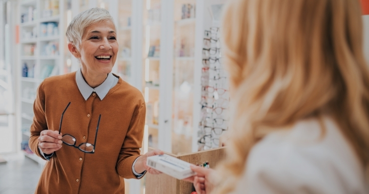 senior adult buying prescription medications at a pharmacy