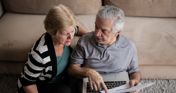 senior adult reviewing documents with an advisor