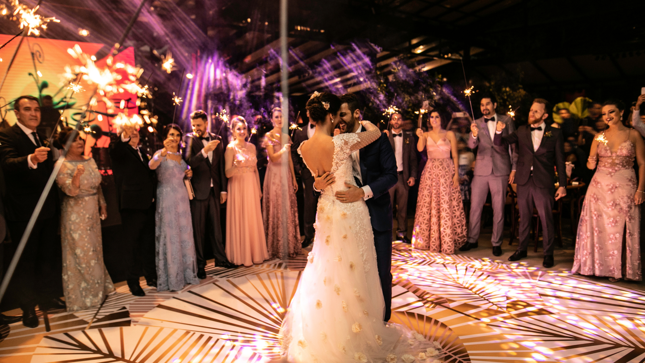 Bride and groom last dance in front of their guests