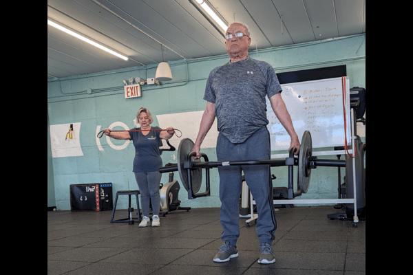 Jorge and Ana doing strength training together.