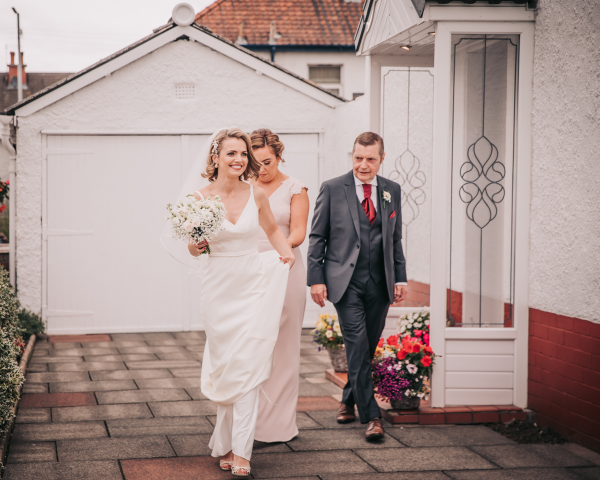 Bride and family leaving home to head to wedding ceremony in Holy Cross Church. Bride and family leaving home to head to wedding ceremony in Holy Cross Church.