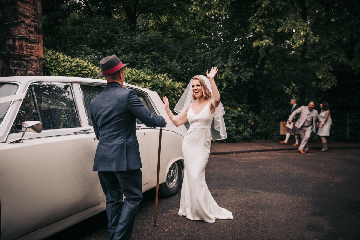 Bride and groom having fun, wedding arriving at reception venue, Glasgow Bride and groom having fun, wedding arriving at reception venue, Glasgow