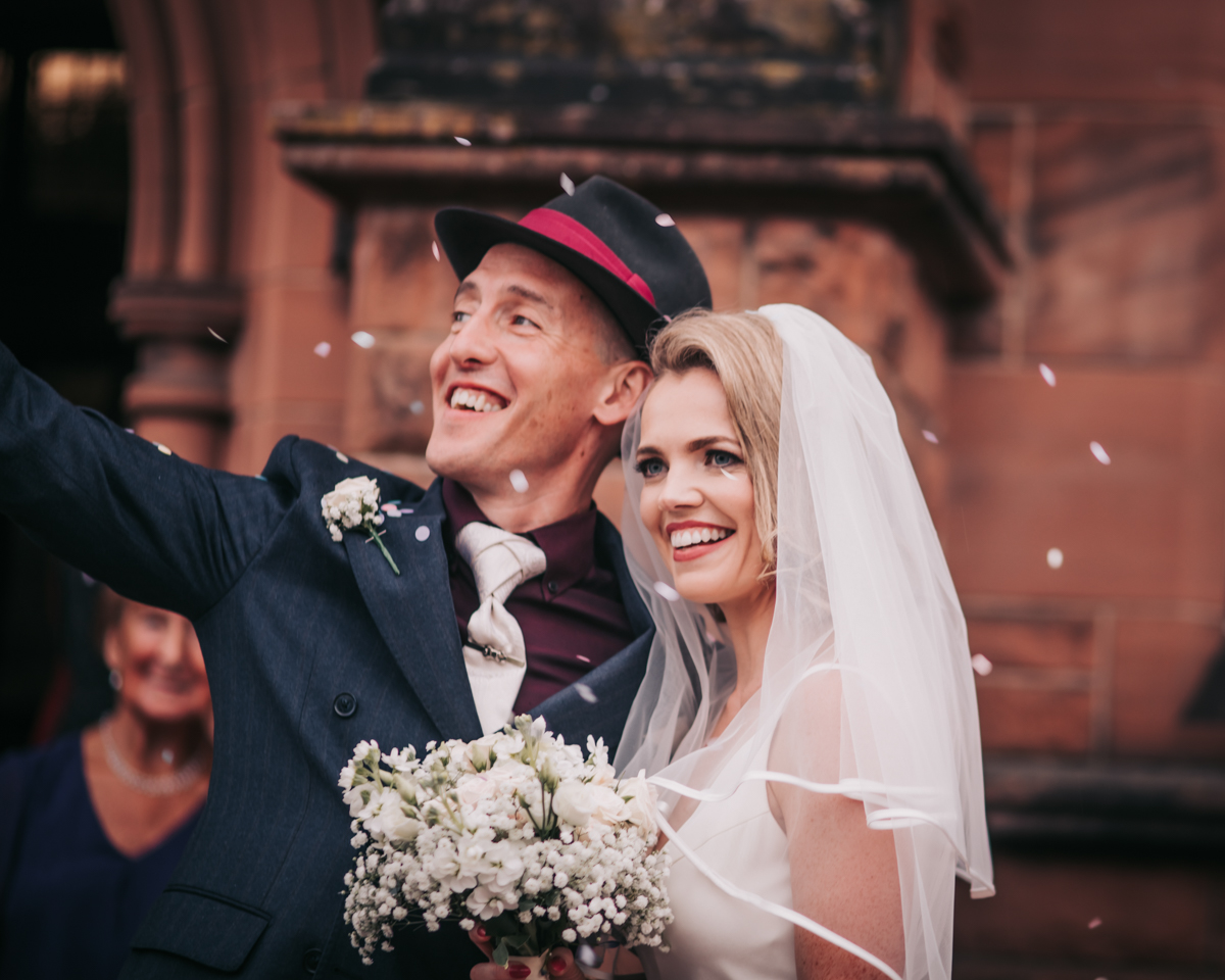 Bride and groom after church wedding, Glasgow, confetti shot. Bride and groom after church wedding, Glasgow, confetti shot.