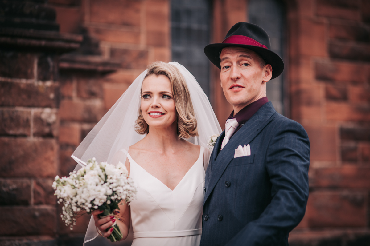 Bride and groom outside wedding venue immediately after wedding ceremony in Glasgow. Bride and groom outside wedding venue immediately after wedding ceremony in Glasgow.