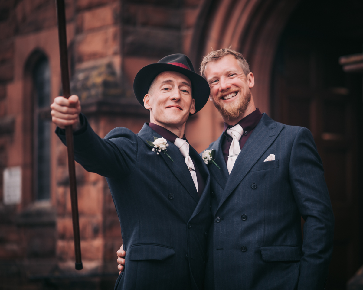 Groom and best man posing for a candid shot outside Holy Cross Catholic Church, Glasgow. Groom and best man posing for a candid shot outside Holy Cross Catholic Church, Glasgow.