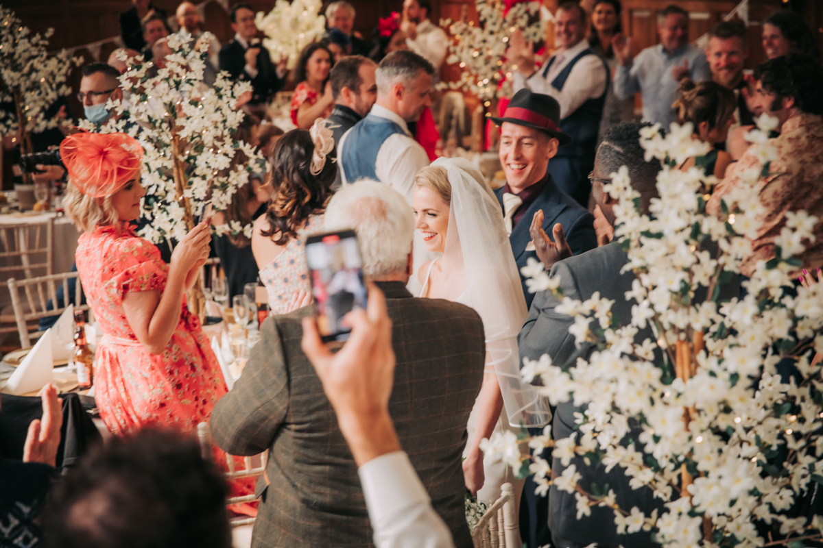 Evening drinks and laughter shared as bride and groom enter for the speeches in Pollokshields Burgh Hall, Glasgow Evening drinks and laughter shared as bride and groom enter for the speeches in Pollokshields Burgh Hall, Glasgow