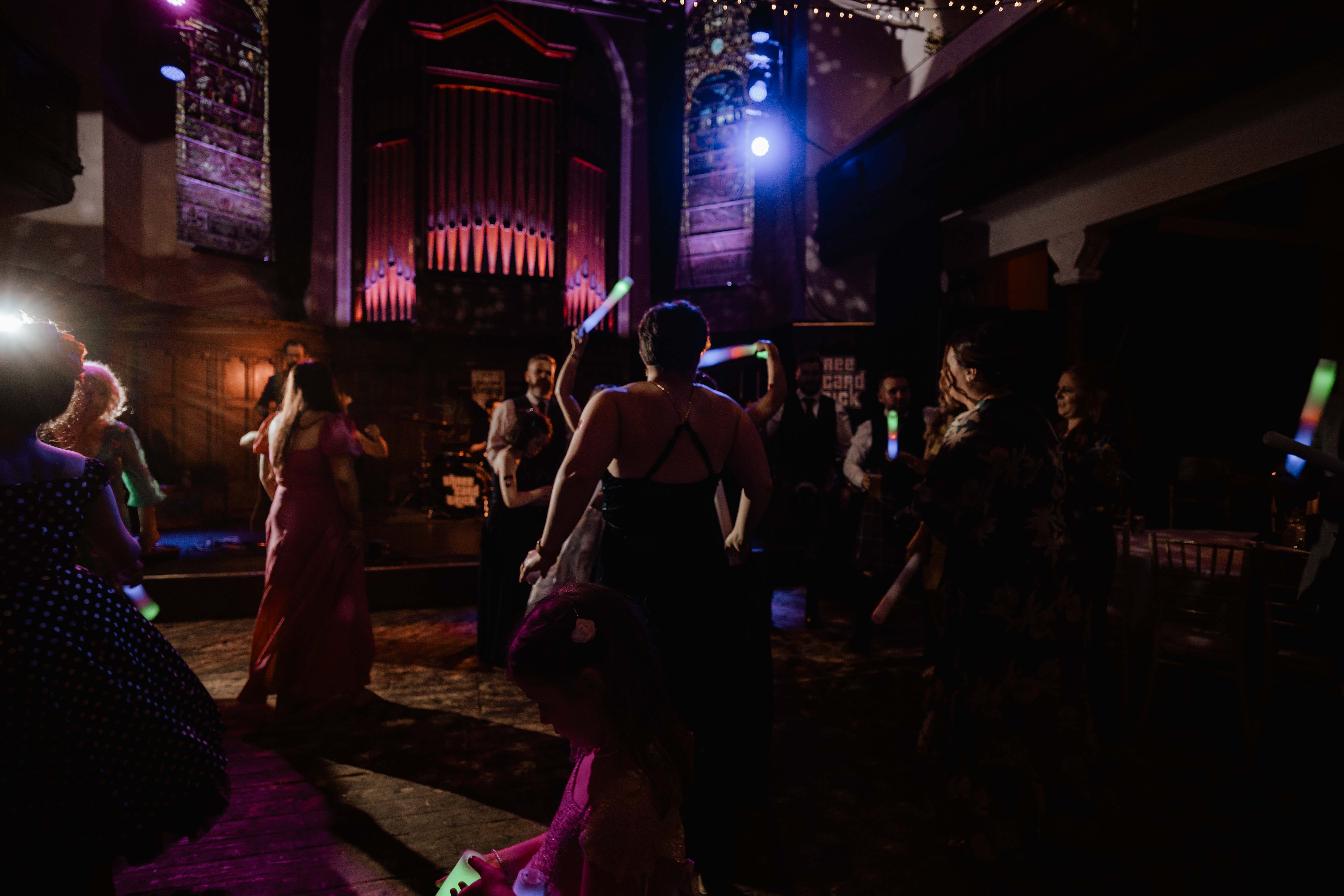 Wedding guests dancing in Saint Luke's, Glasgow. Wedding guests dancing in Saint Luke's, Glasgow.