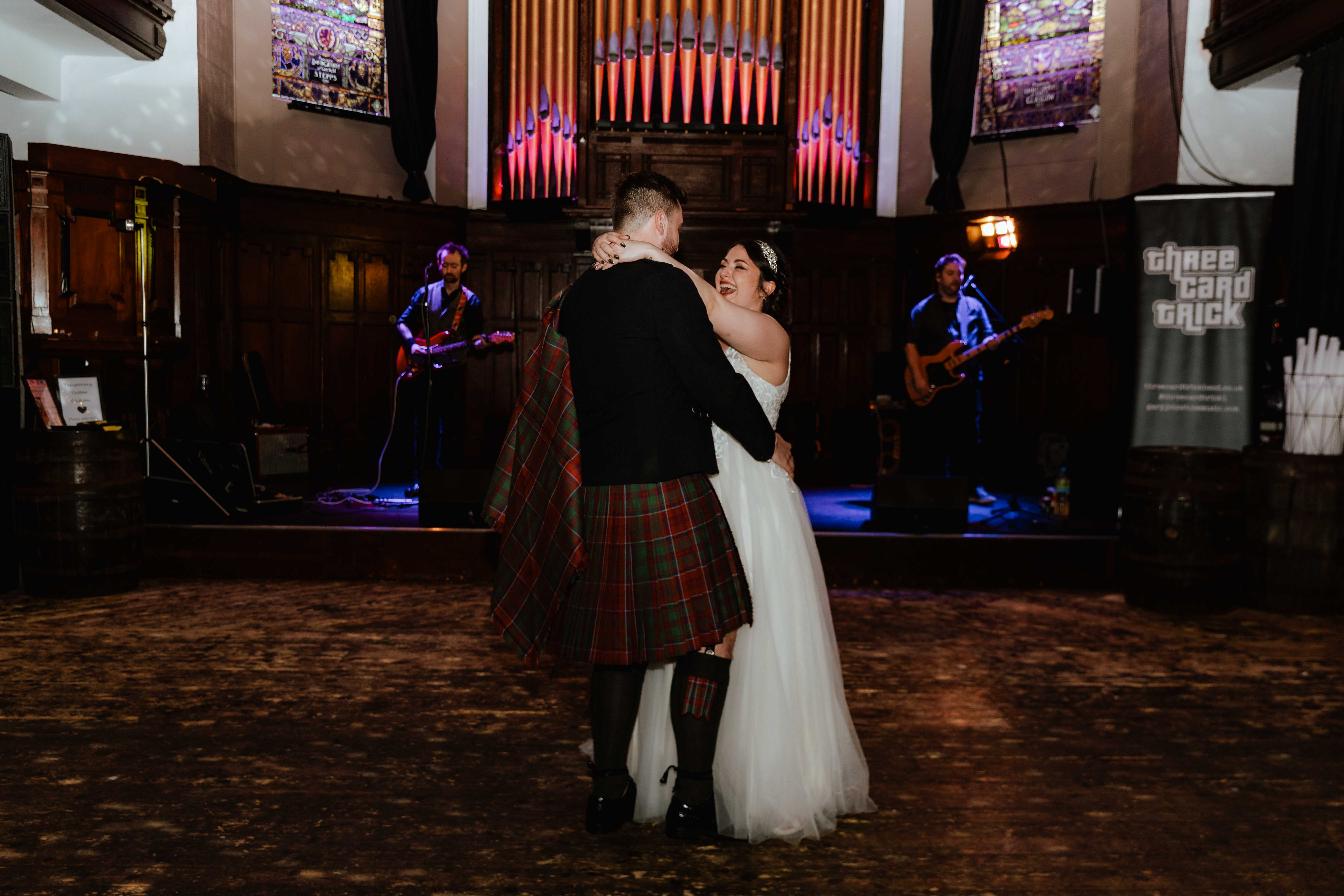 Bride and Groom first dance in wedding venue, St. Luke's, Glasgow. Bride and Groom first dance in wedding venue, St. Luke's, Glasgow.