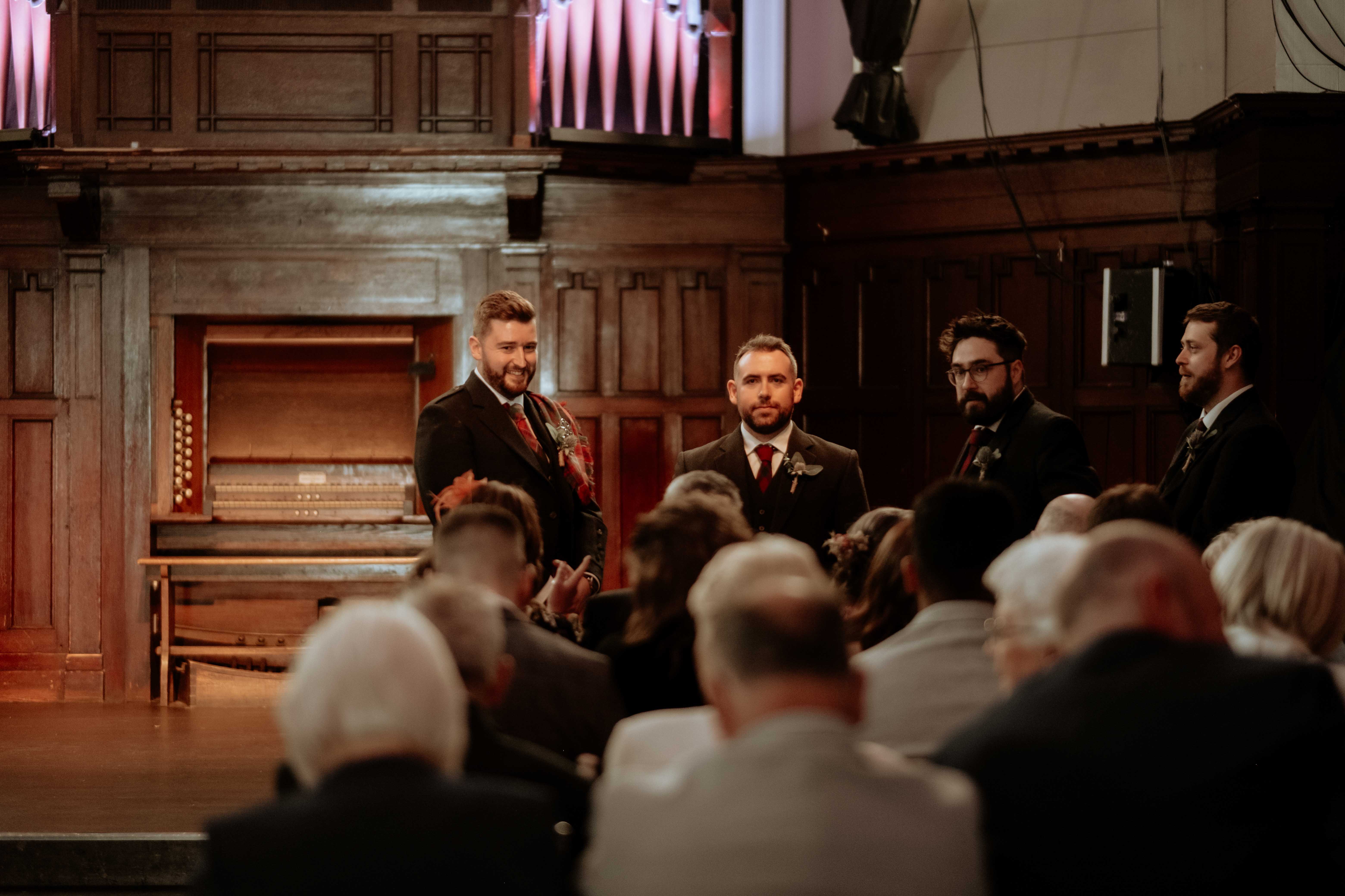 Groom and best men interacting before the wedding ceremony in St. Luke's, Glasgow. Groom and best men interacting before the wedding ceremony in St. Luke's, Glasgow.