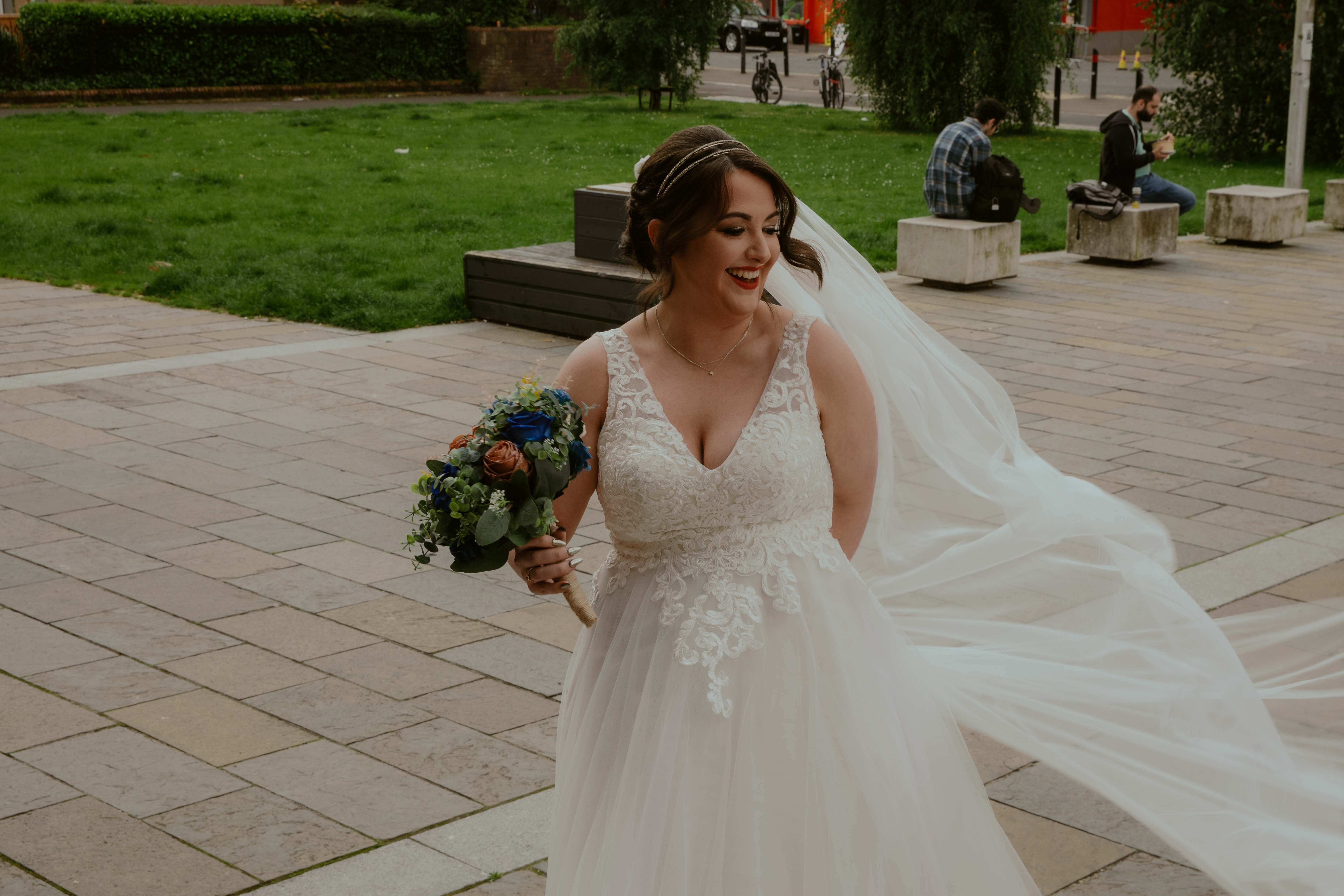 Natural moment of bride as she is about to make her way up to the steps of the wedding venue. Natural moment of bride as she is about to make her way up to the steps of the wedding venue.