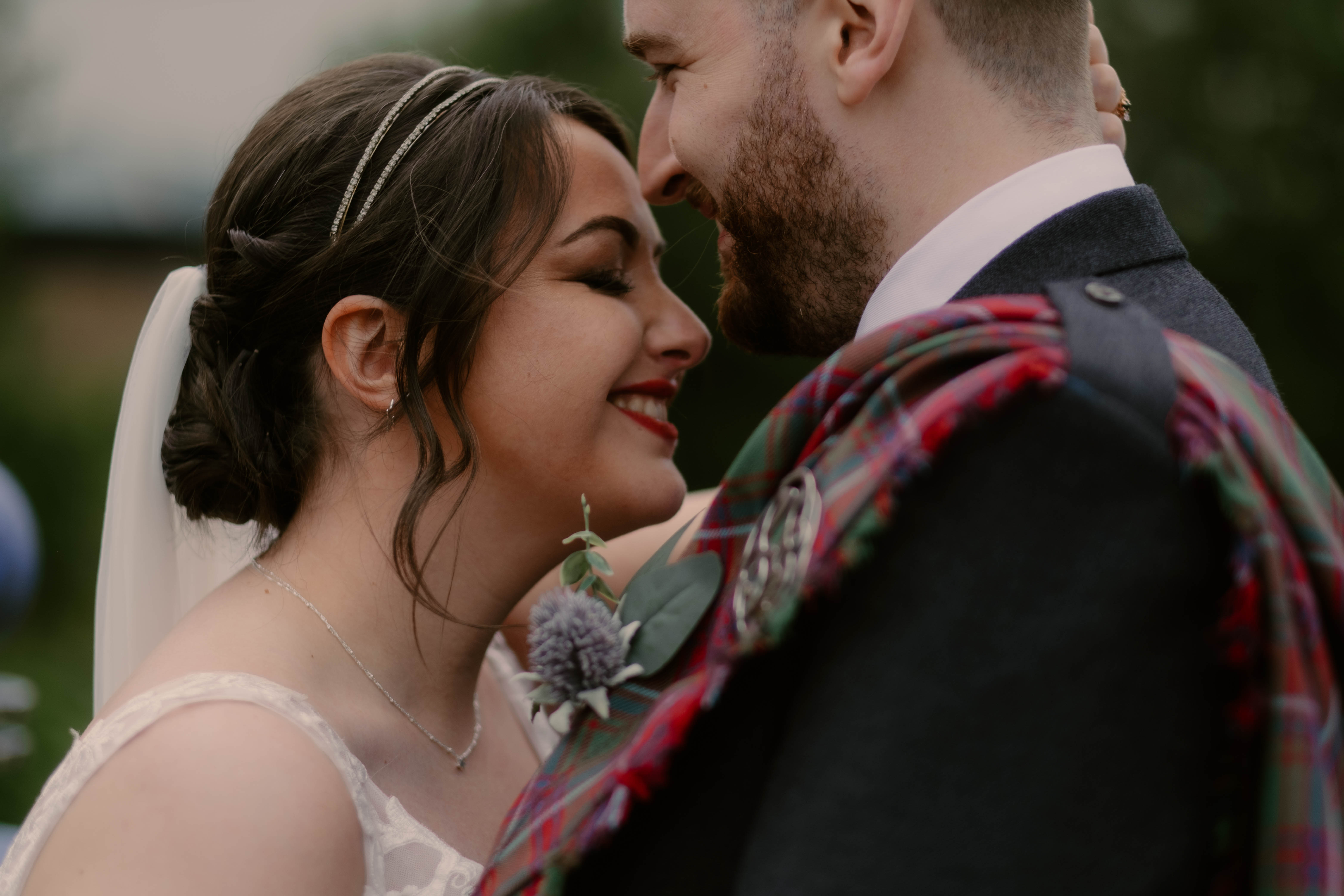 Close up shot of bride and groom, foreheads touching, near Glasgow Green, Glasgow Close up shot of bride and groom, foreheads touching, near Glasgow Green, Glasgow