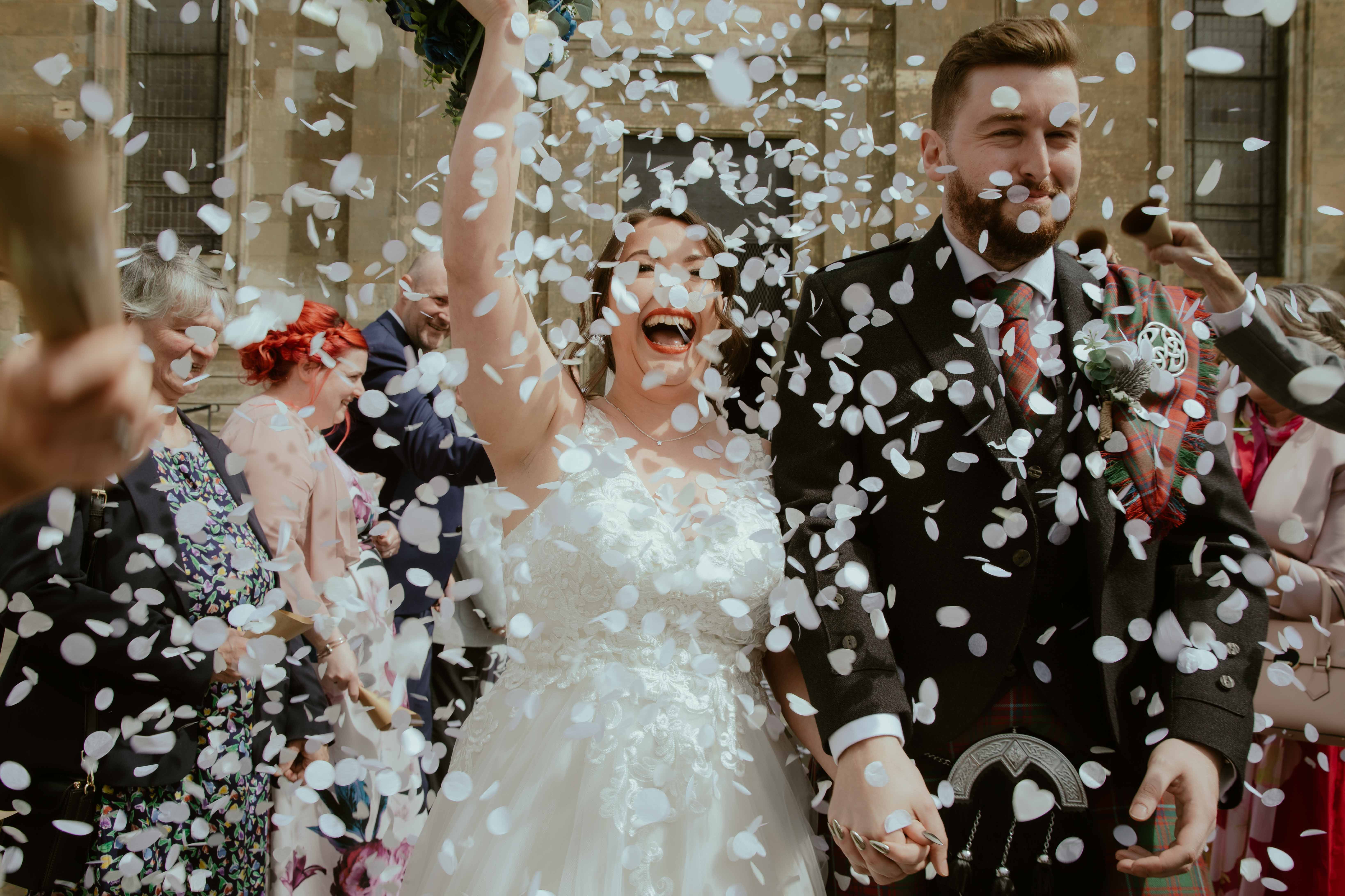 Confetti shot of bride and groom on the steps of Saint Luke's, Glasgow. Confetti shot of bride and groom on the steps of Saint Luke's, Glasgow.