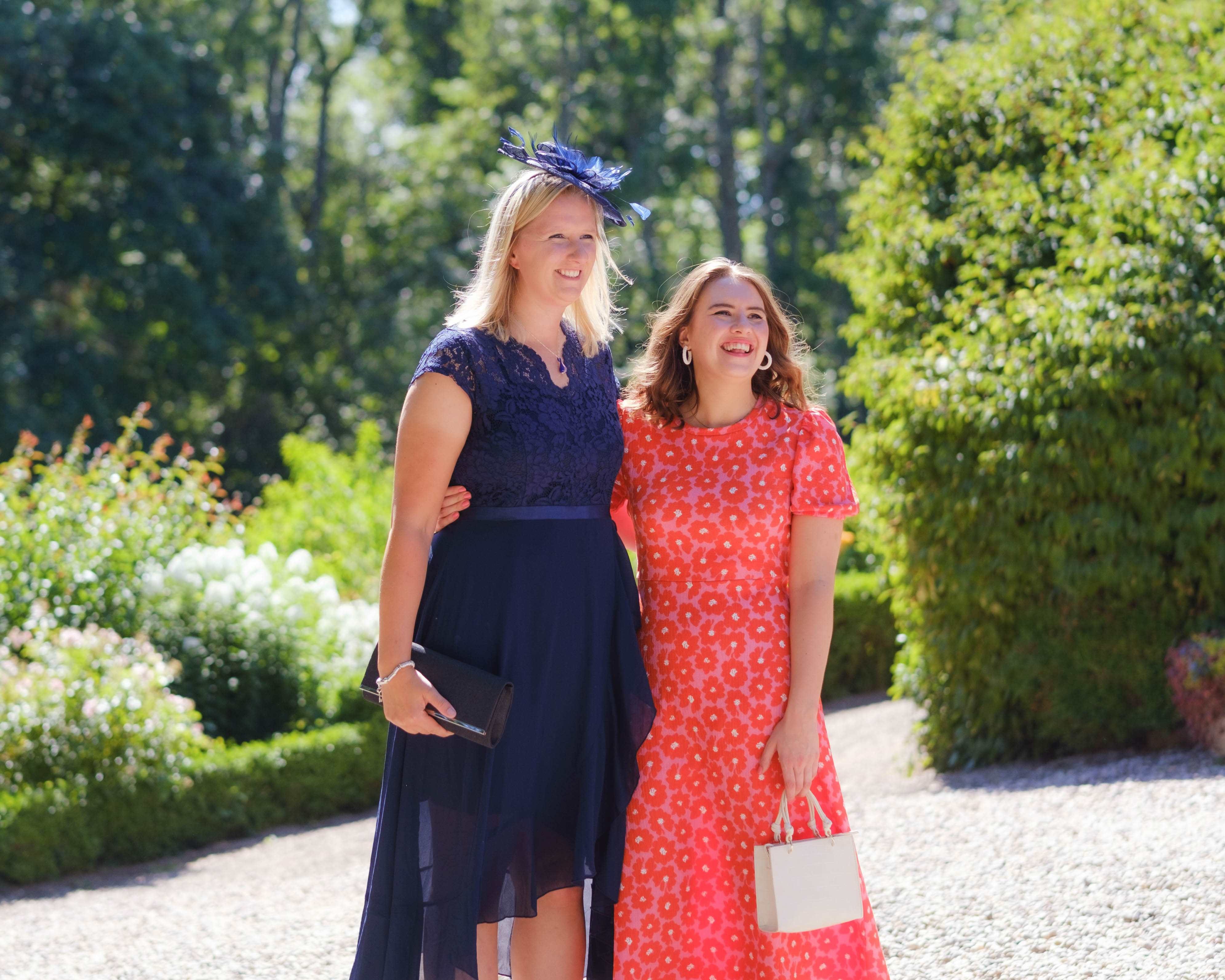 Two wedding guests before the outdoor ceremony, admiring Kippilaw House, Scottish Borders Two wedding guests before the outdoor ceremony, admiring Kippilaw House, Scottish Borders