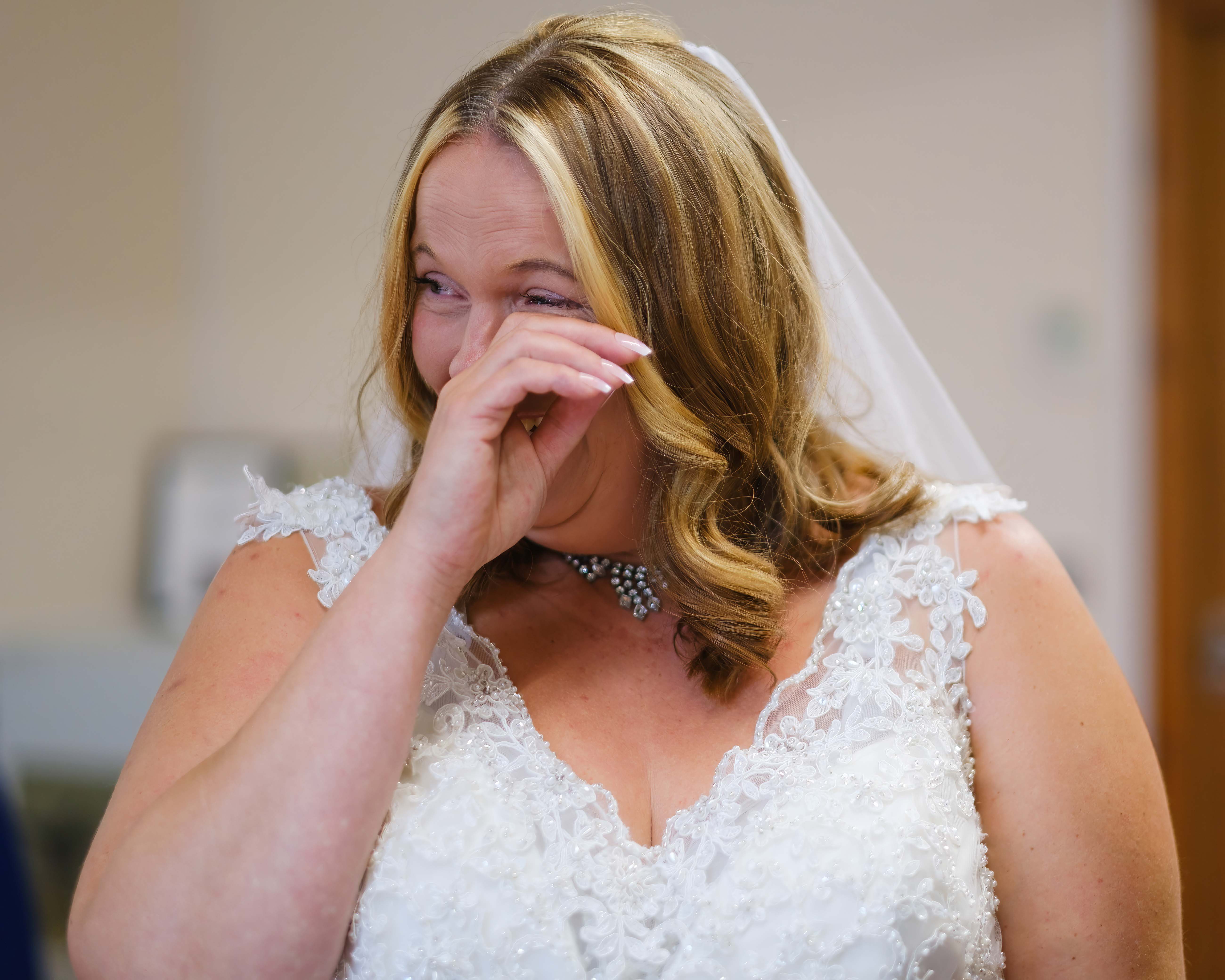 Bride crying tears of overwhelm during her wedding ceremony in Newton Stewart Bride crying tears of overwhelm during her wedding ceremony in Newton Stewart