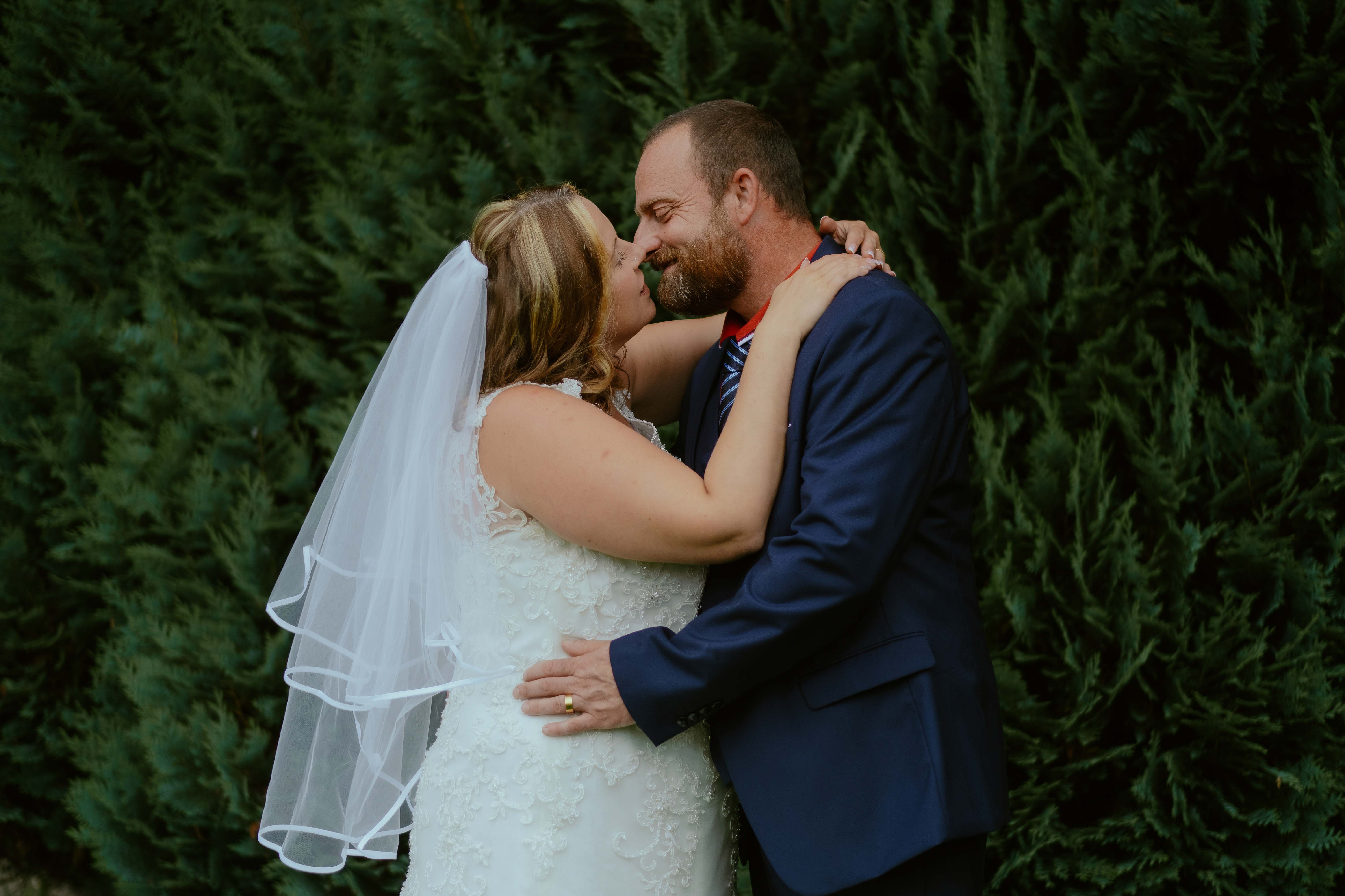 Bride and groom kissing, Creebridge House Hotel gardens, Newton Stewart Bride and groom kissing, Creebridge House Hotel gardens, Newton Stewart