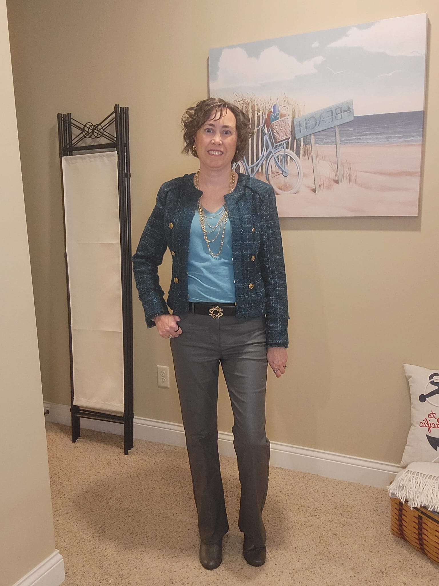 Styled by Jenn fall outfit featuring a WHBM teal tweed jacket and light teal V-neck tee from Loft, styled with a gold multi-strand necklace, black belt, and gray coated denim boot-cut jeans — a modern take on tweed by personal stylist Jennifer Whitacre, blending classic elegance with sleek, contemporary edge.