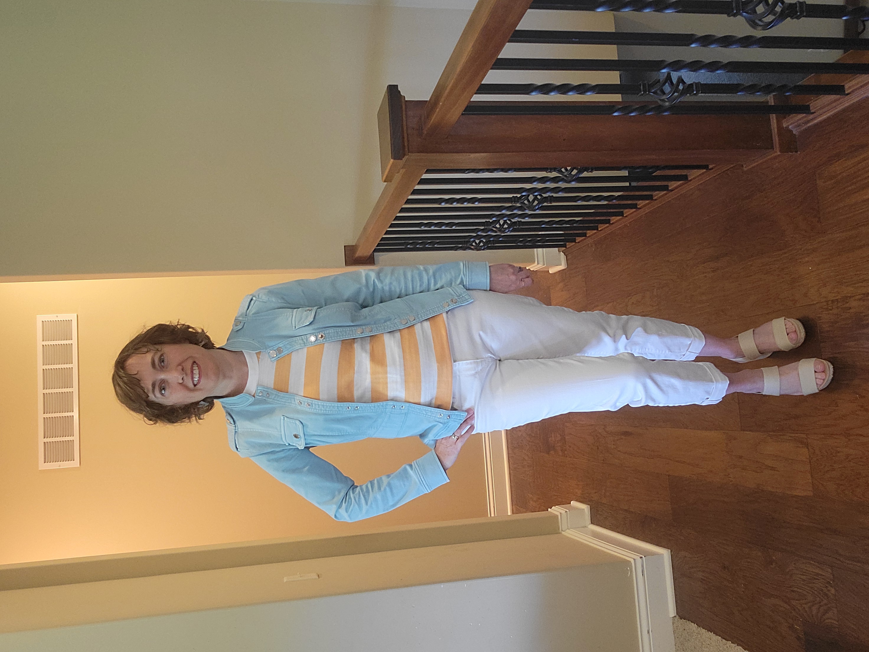 Stylish summer outfit featuring a WHBM blue jacket layered over a Loft orange and white striped sweater tank, paired with Loft white jeans. A fresh and colorful look perfect for warm weather with a polished, casual vibe.
