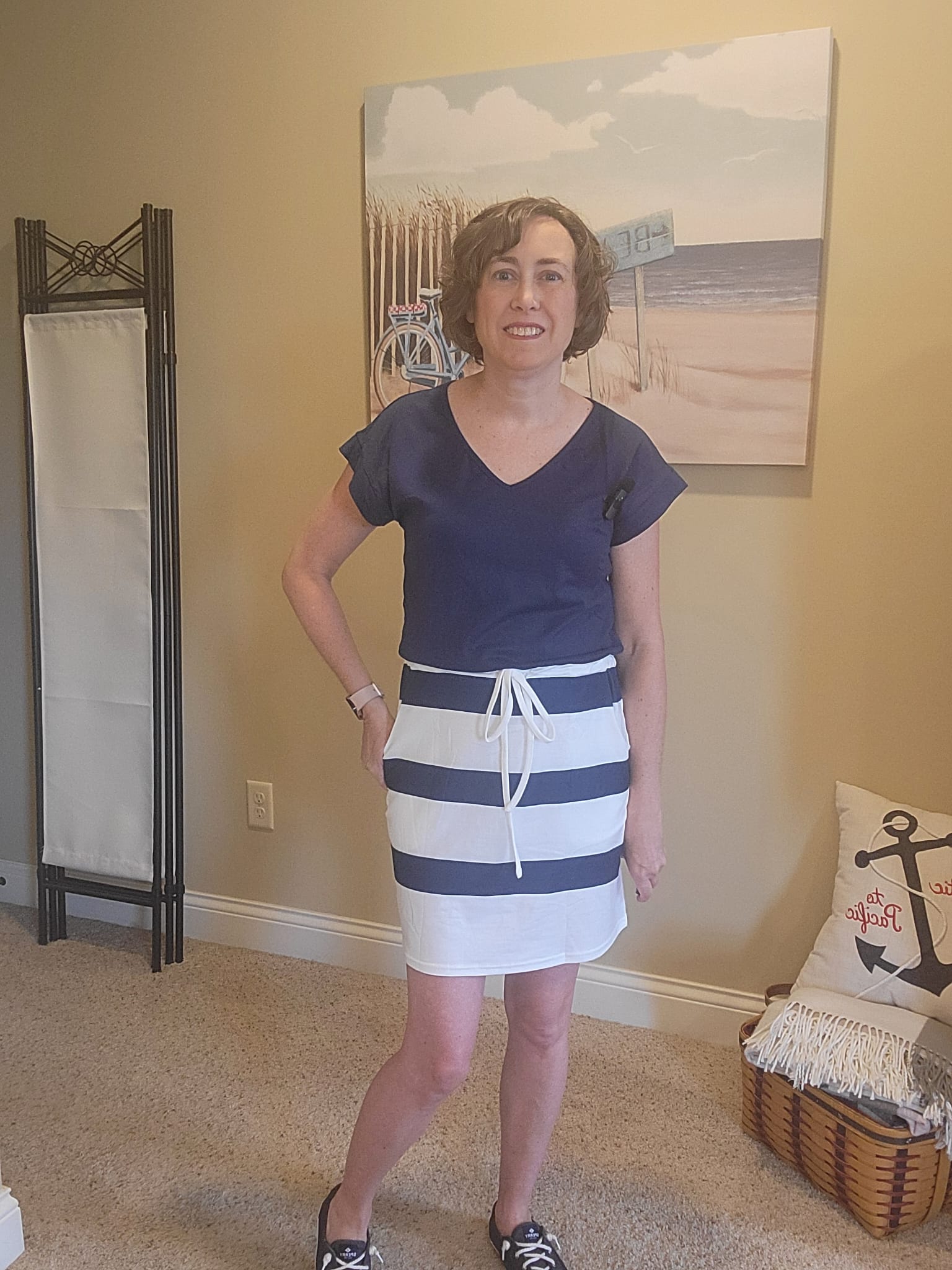 Jenn wearing a navy and white striped dress from Amazon, styled for a comfortable and effortlessly chic everyday outfit.