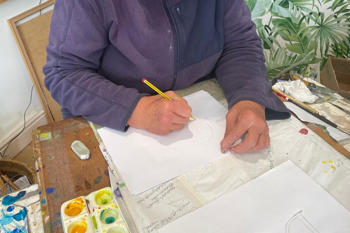 Diana drawing during an art course.