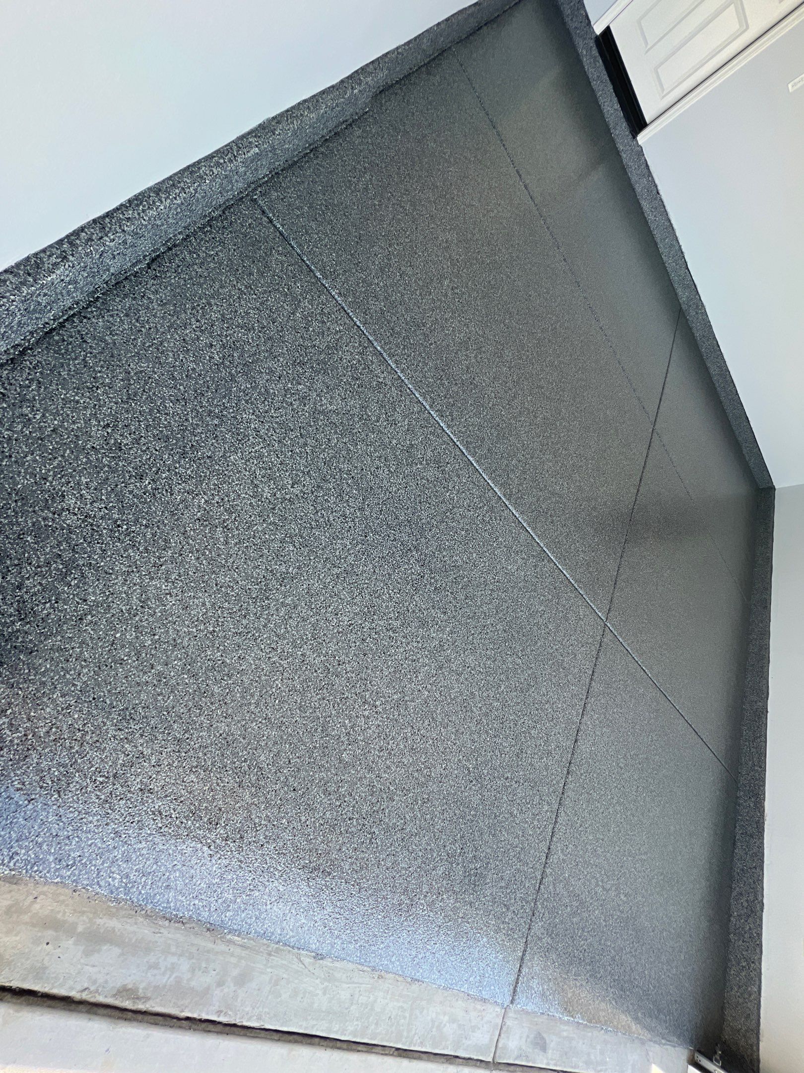 Close up of epoxy flake floor texture in West Texas