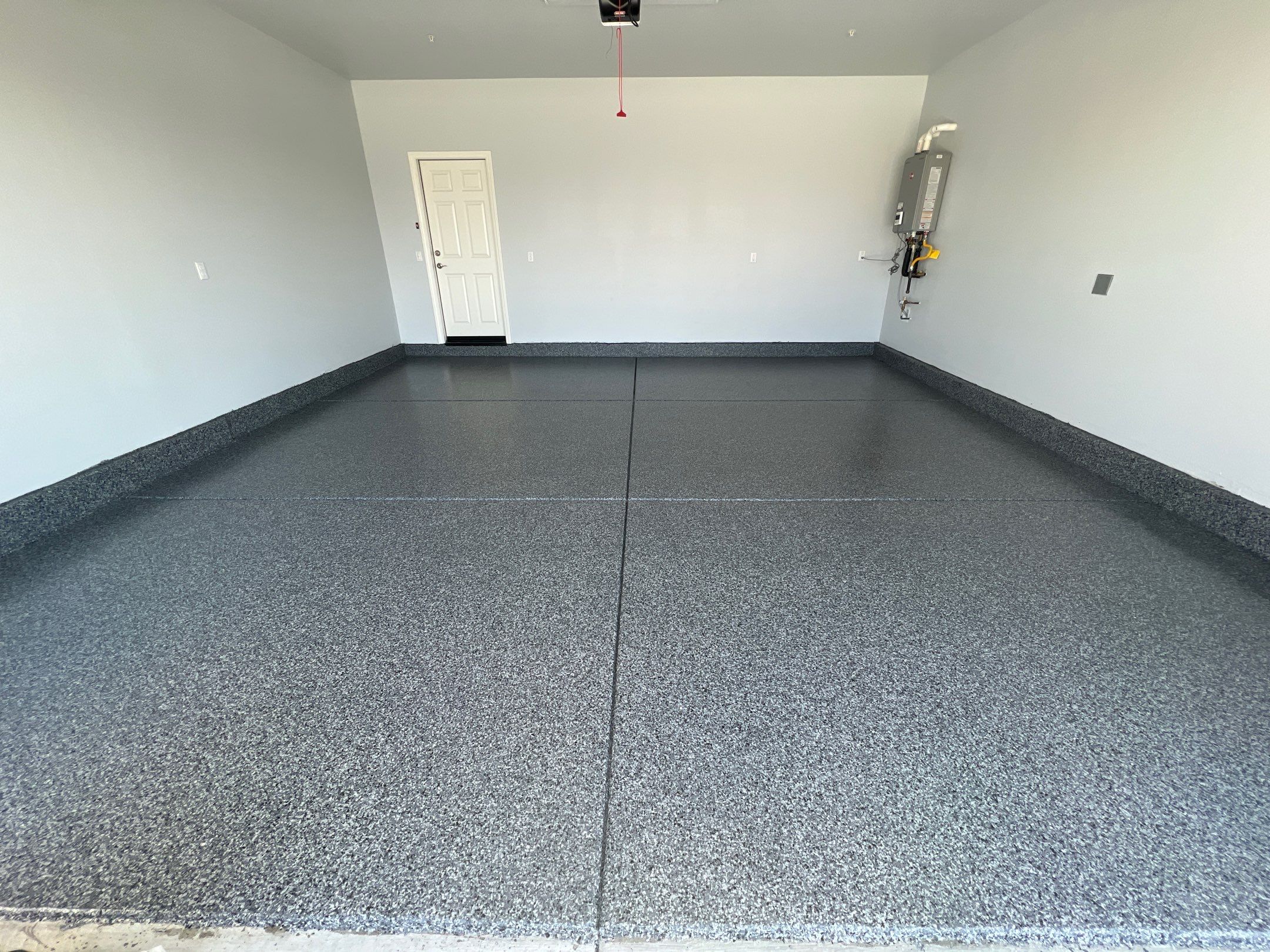 Nightfall epoxy flake garage floor with polyaspartic topcoat in Odessa Texas