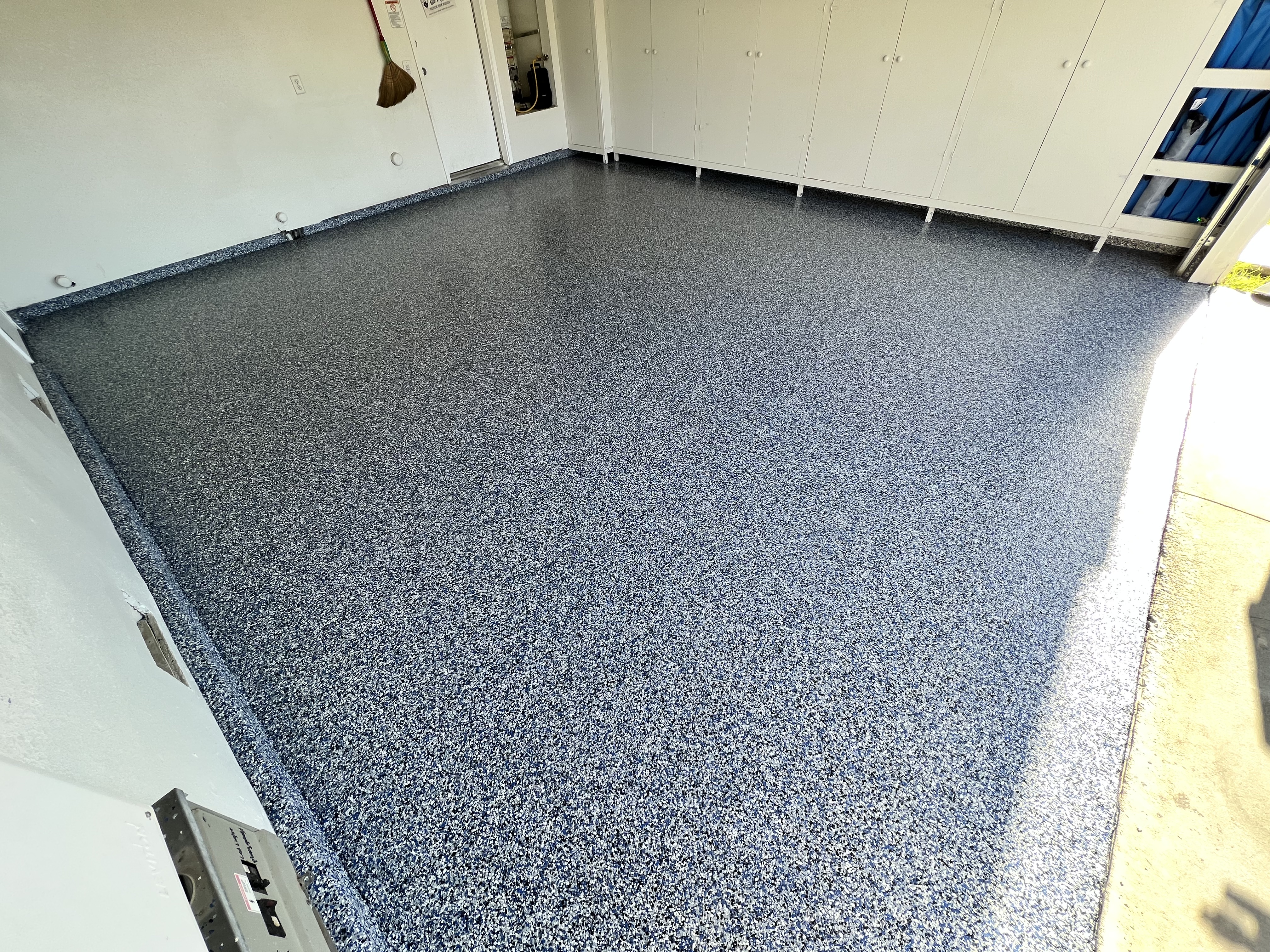 Garage flake epoxy floor close up in Odessa Texas