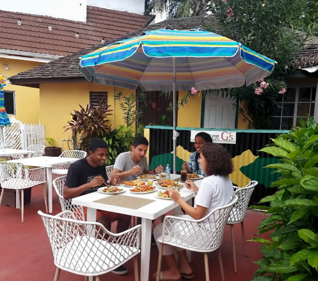 Group eating in queen g's restaurant