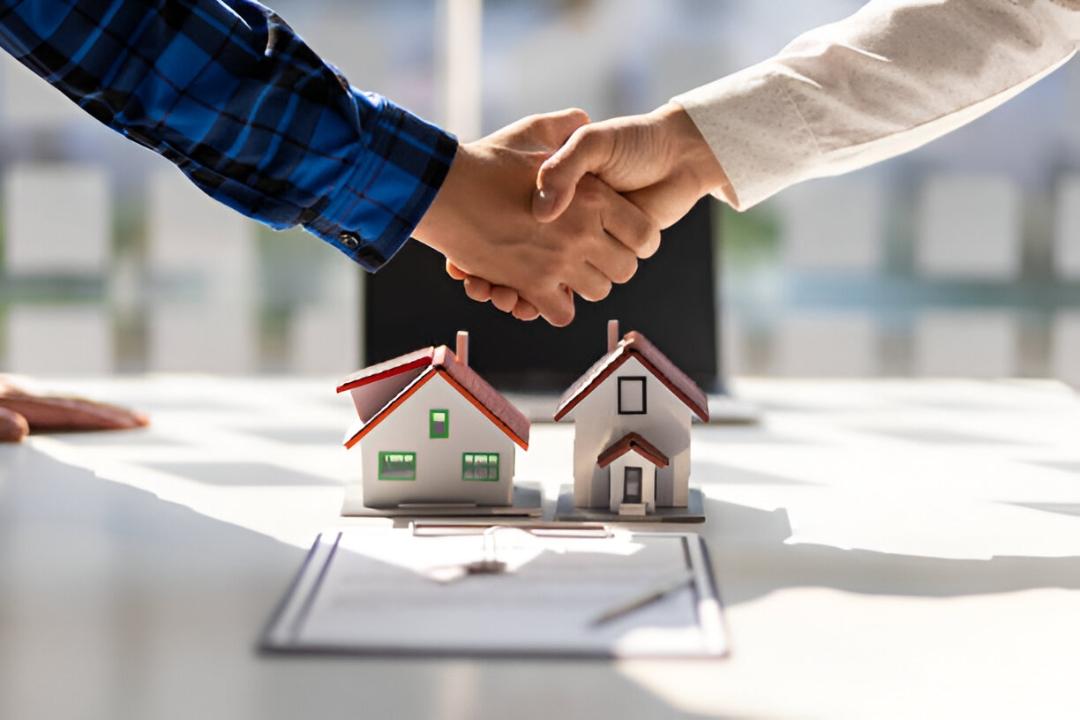 Two hands shake over miniature houses, symbolizing a deal for Penalty box home buyers with KBR Investing. Two hands shake over miniature houses, symbolizing a deal for Penalty box home buyers with KBR Investing.
