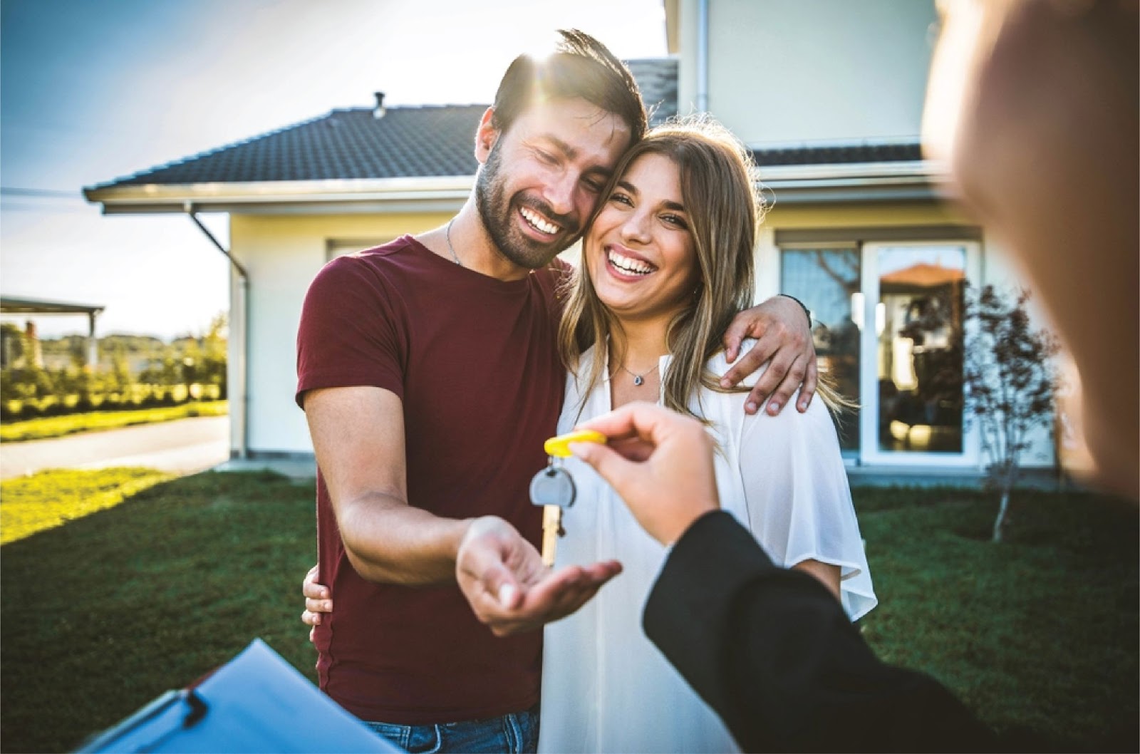 A young family sits happily under a cardboard roof, representing No bank financing homes available through KBR Investing. A young family sits happily under a cardboard roof, representing No bank financing homes available through KBR Investing.