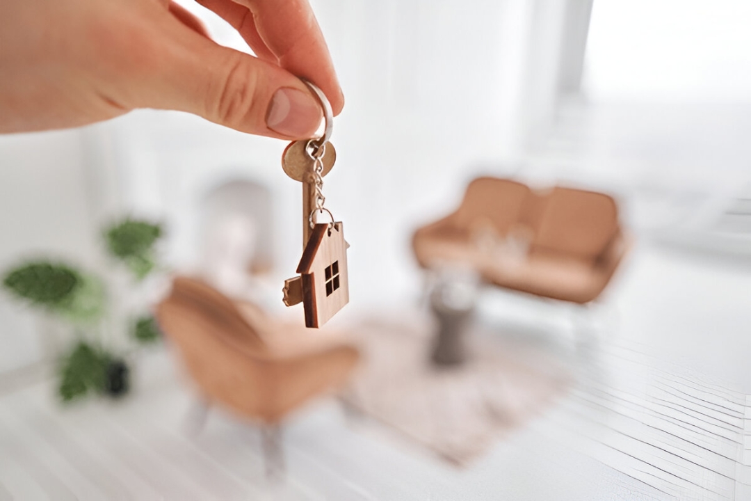 A realtor points to a document while a client signs, with a house model, representing Financing solutions for people with low credit scores from KBR Investing. A realtor points to a document while a client signs, with a house model, representing Financing solutions for people with low credit scores from KBR Investing.