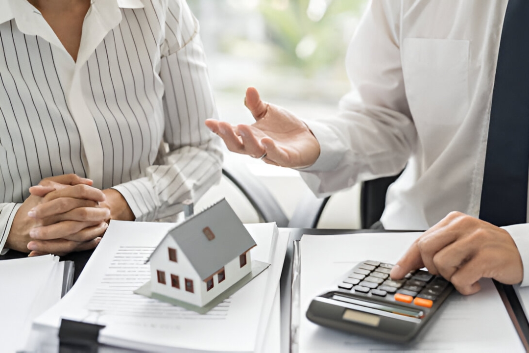 A real estate agent discusses options with a client, illustrating owner financing for penalty box buyers from KBR Investing. A real estate agent discusses options with a client, illustrating owner financing for penalty box buyers from KBR Investing.