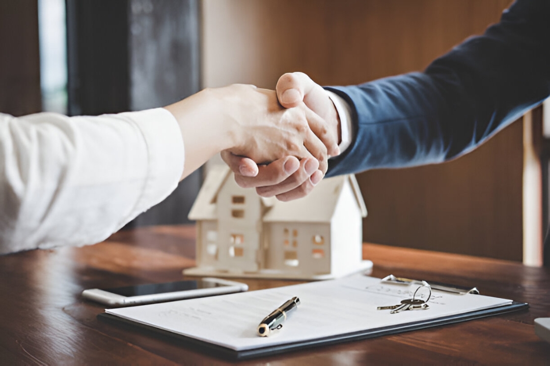 A handshake over a house model and papers, symbolizing Overcoming bank rejection with owner financing through KBR Investing. A handshake over a house model and papers, symbolizing Overcoming bank rejection with owner financing through KBR Investing.