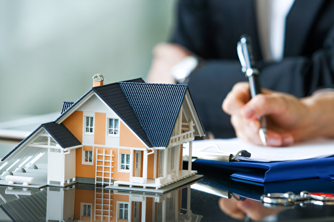  A professional with a house model and documents, discussing Owner financing for first-time homebuyers from KBR Investing.