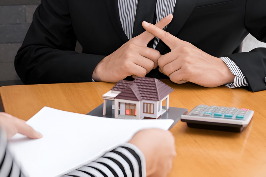  A man and woman review documents with a real estate agent, discussing Mortgage alternatives for penalty box buyers with Buy a house with low credit.