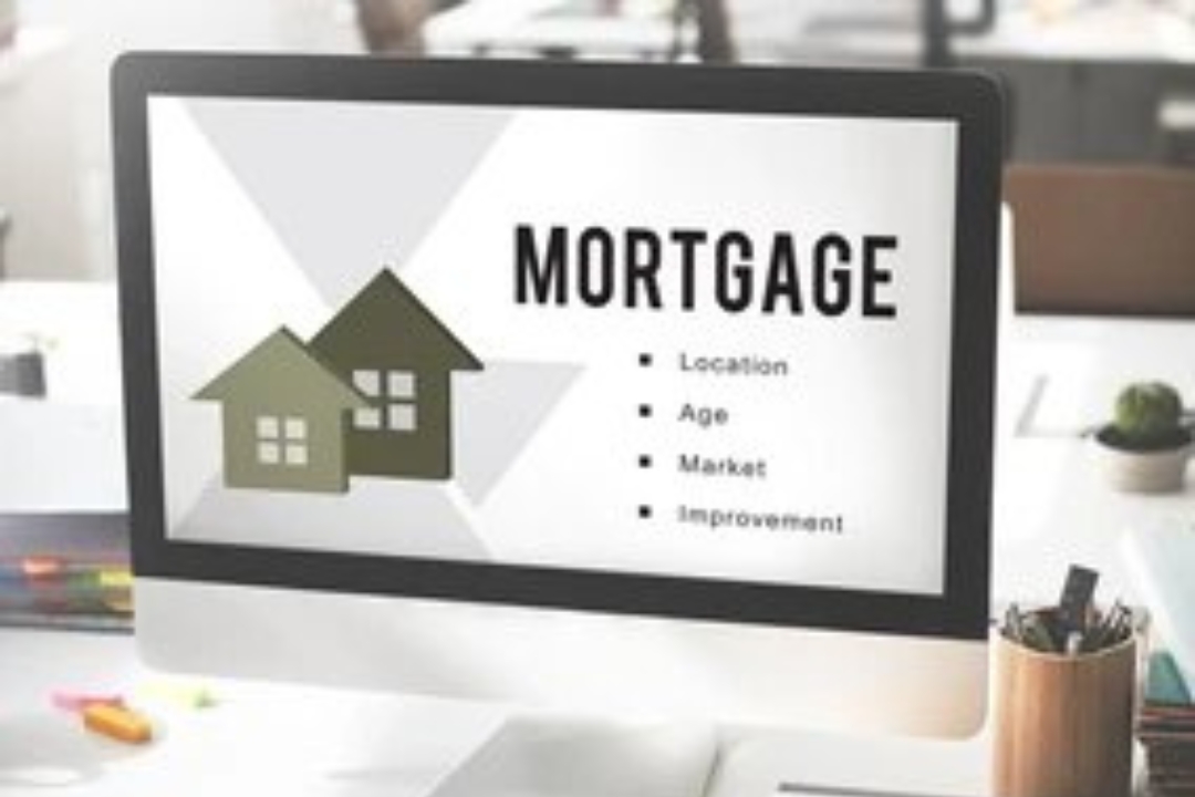 A computer monitor displays mortgage information with house icons, relevant to Homes for sale with owner financing offered by Kbr investing.