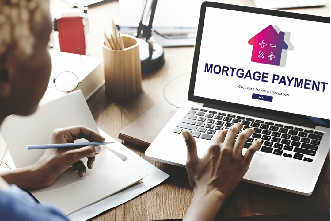 The uploaded image shows a person working on a laptop displaying "MORTGAGE PAYMENT", representing Kbr investing's guidance to Buy a home on a visa.