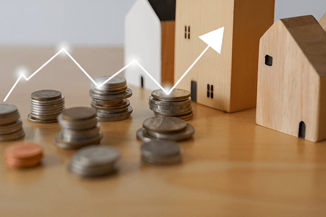 Stacks of coins with wooden houses and growth arrow, showing ways to buy a house without mortgage through Kbr Investing strategies.