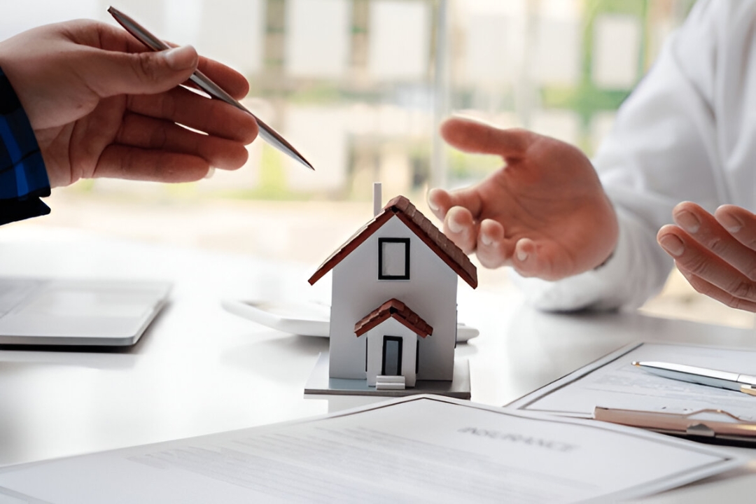 Two people discussing property paperwork with a miniature house model, showcasing homes for sale with no bank financing at KBR Investing. Two people discussing property paperwork with a miniature house model, showcasing homes for sale with no bank financing at KBR Investing.