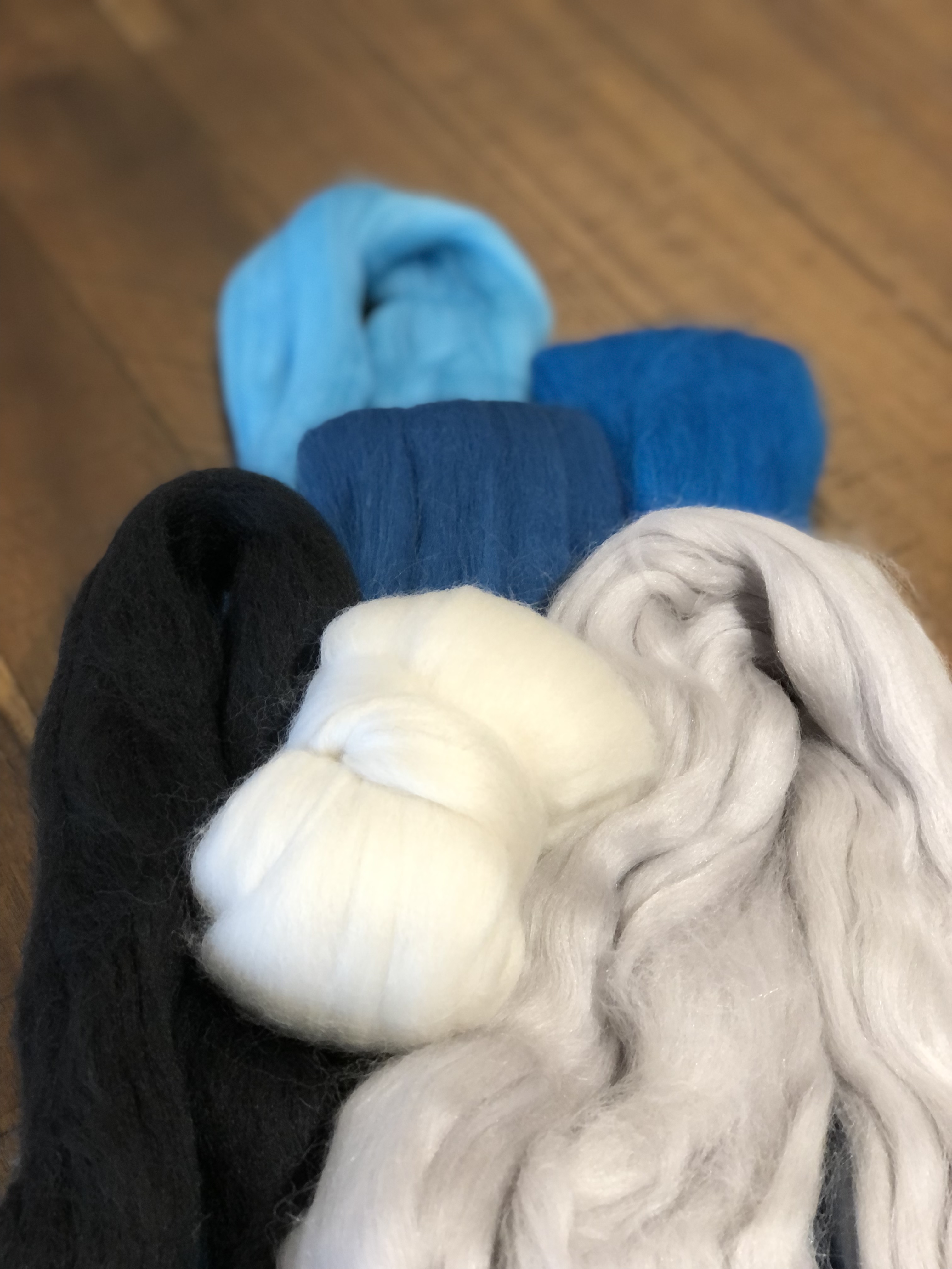 selection of wool to create a blue jay