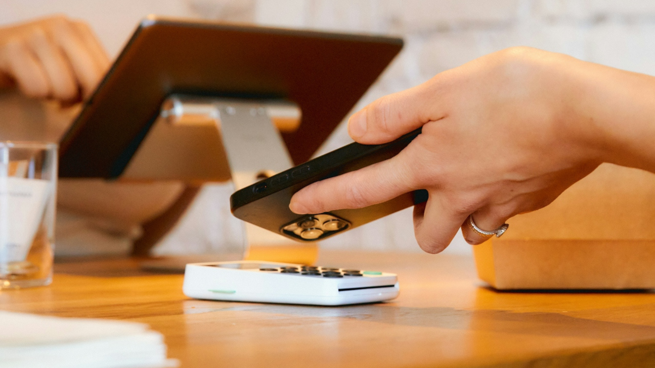 a customer paying for goods with touchless payment a customer paying for goods with touchless payment