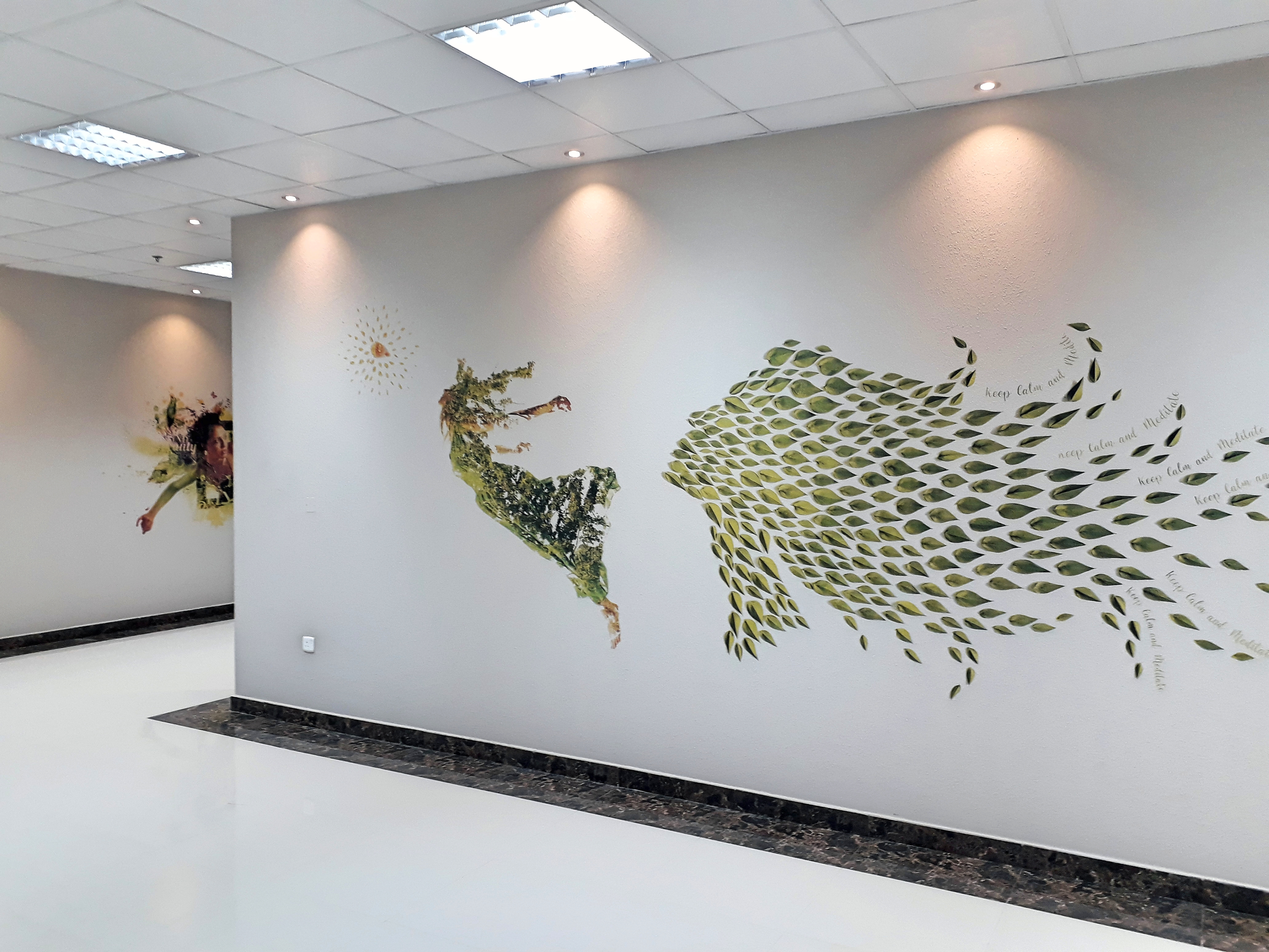 Employees collaborating on workplace mural design East Coast Mural Pros