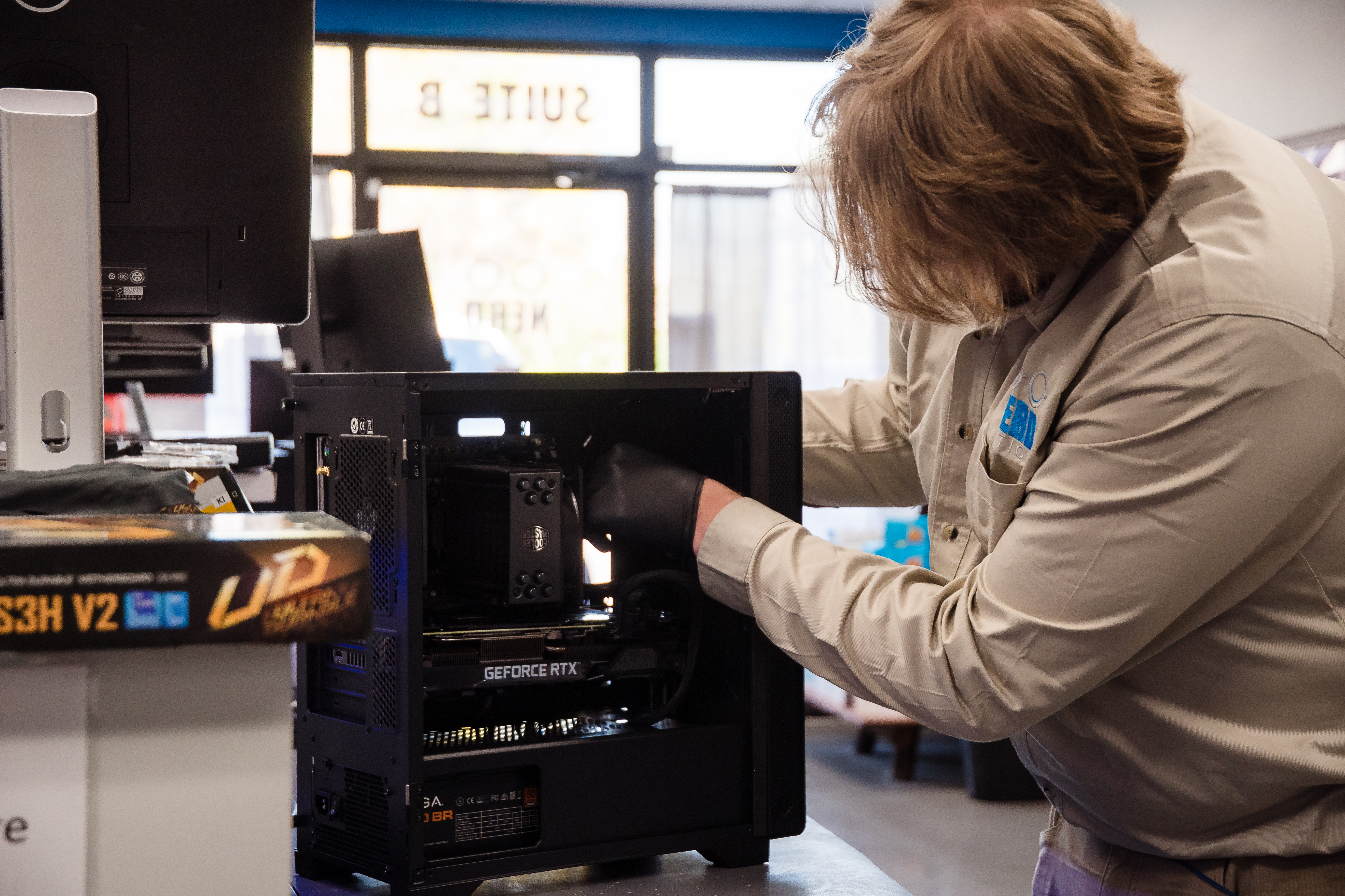 A Nerd Nation employee assembling a PC.