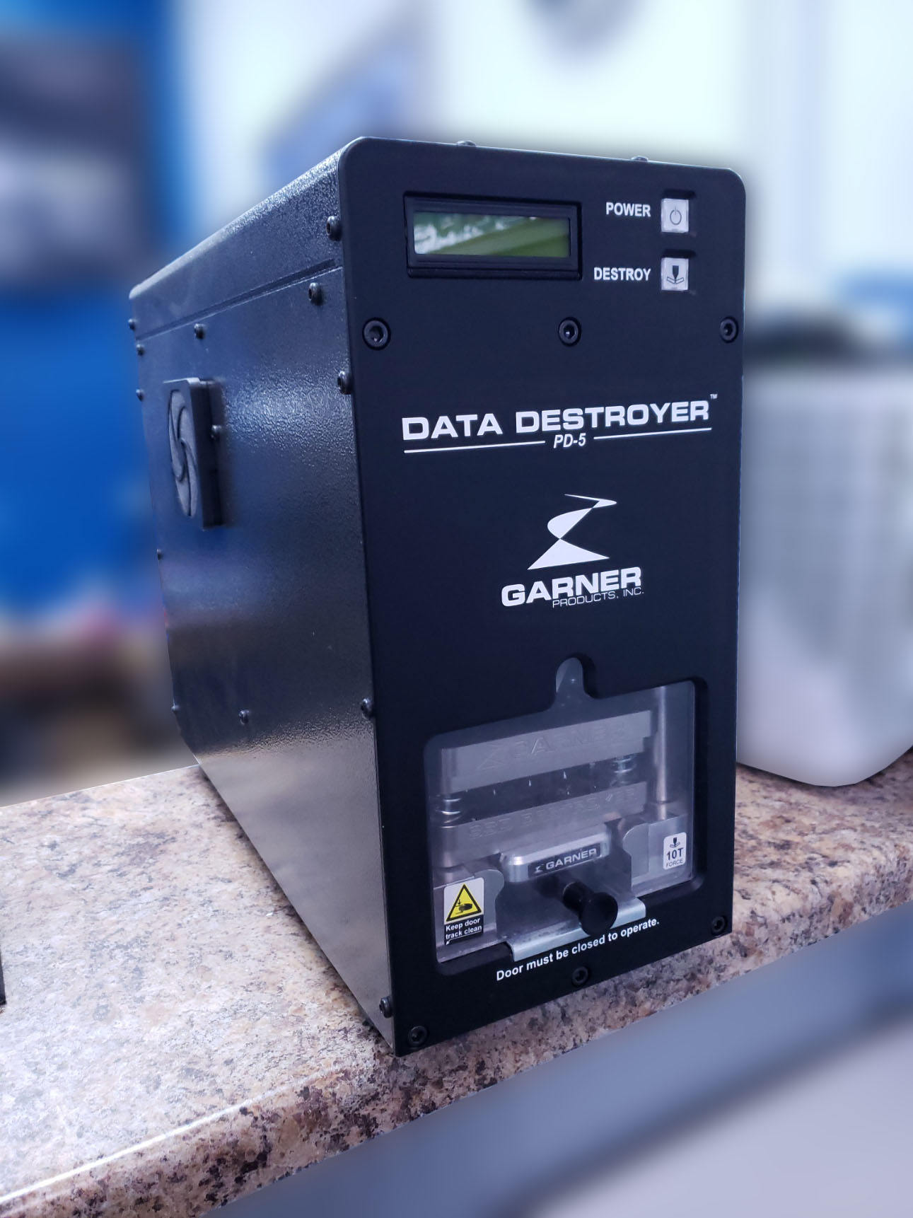 A photo of a hard drive crushing machine.