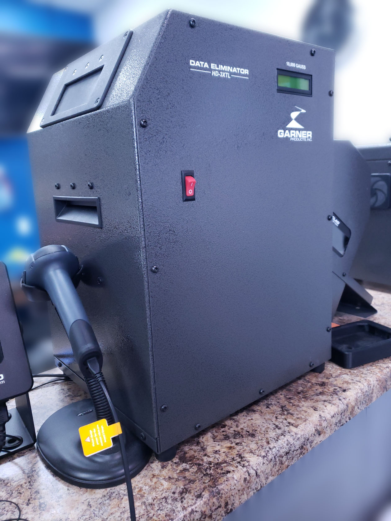 A photo of a hard drive degaussing machine.